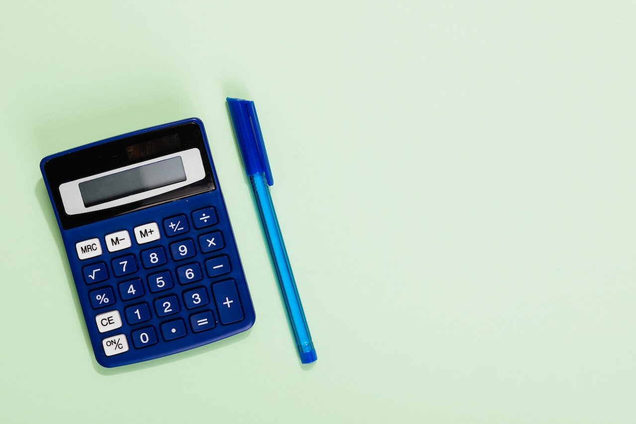 Calculator and pen represents RFM calculations